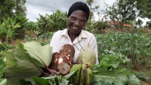 Eunice proudly shows produce from her farm Photo: © Biovision Peter-Luthi